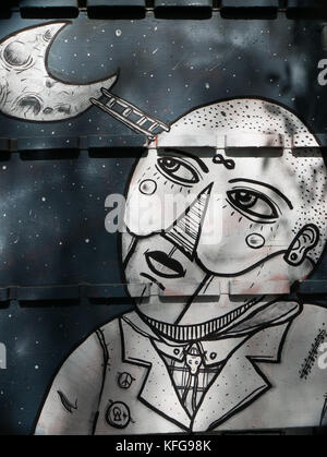 Nahaufnahme Foto Poster auf der Wand zeigt eine schwarze Linie zeichnen Mann an einem Halbmond mit einer Leiter seinen Kopf verbinden mit dem Mond. Stockfoto