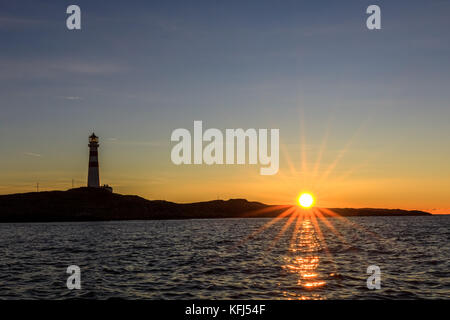 Oksoy Leuchtturm bei Sonnenaufgang, Kristiansand Norwegen Stockfoto