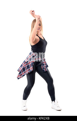 Dance Hall oder Jazz Dance woman dancing mit Waffen mit kariertes Hemd in der Taille gebunden. volle Gehäuselänge Portrait auf weißem Hintergrund. Stockfoto