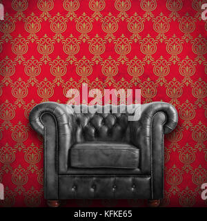 Classic schwarz Leder Sessel mit rotem Hintergrund. Stockfoto
