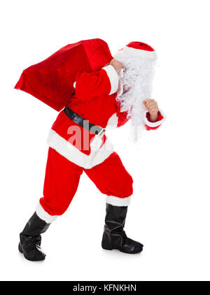 Portrait von Santa mit Sack auf weißem Hintergrund Stockfoto