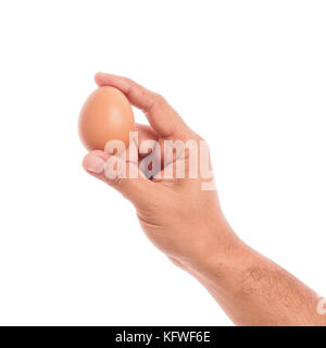 Männliche Hand zeigen Ei auf weißem Hintergrund Stockfoto