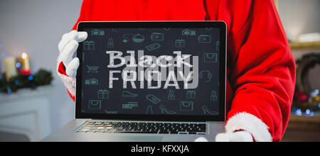 Schwarzer Freitag Anzeige gegen Santa Claus mit einem Laptop Stockfoto