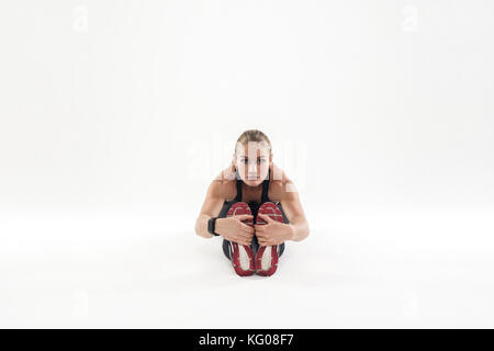 Fitness Frau an der Arbeit, Morgen, Neigen nach vorn. studio Shot Stockfoto