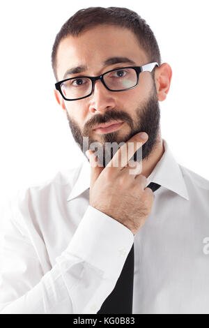 Young Business Mann berührt seine Bart Stockfoto