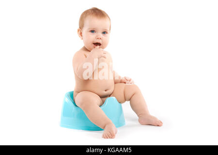 Kind sitzen auf dem Töpfchen Stockfoto