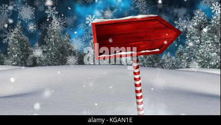 Digital composite der hölzernen Wegweiser in Weihnachten Winter Landschaft Stockfoto