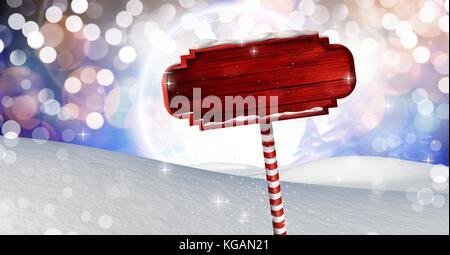 Digital composite der hölzernen Wegweiser in Weihnachten Winter Landschaft Stockfoto