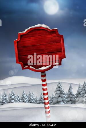 Digital composite der hölzernen Wegweiser in Weihnachten Winter Landschaft Stockfoto
