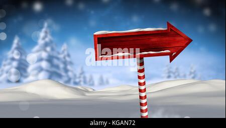 Digital composite der hölzernen Wegweiser in Weihnachten Winter Landschaft Stockfoto