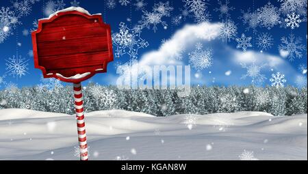 Digital composite der hölzernen Wegweiser in Weihnachten Winter Landschaft Stockfoto