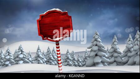 Digital composite der hölzernen Wegweiser in Weihnachten Winter Landschaft Stockfoto