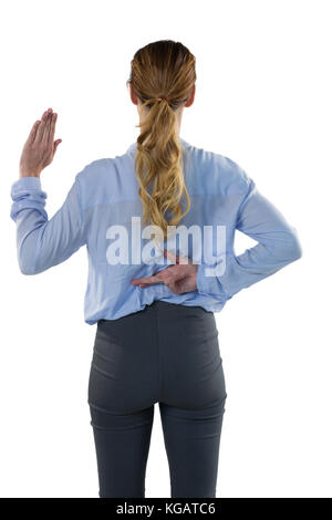 Rückansicht des weiblichen executive gestikulieren vor weißem Hintergrund Stockfoto