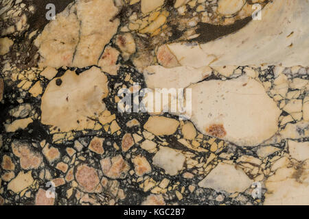 Granit Hintergrund, Creme mit schwarzen Adern. creme schwarz, beige und braun Granit Muster, abstrakt. Stockfoto