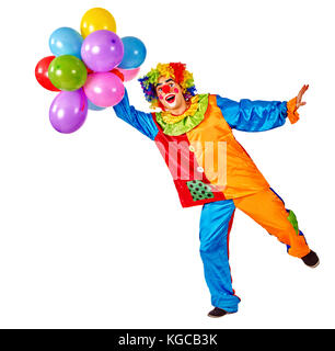 Geburtstag Kind Clown mit Luftballons Bündel auf isoliert. Veranstaltungen Veranstalter Mann auf einem Bein stehend auf weißen Hintergrund ist. Organisation der Kinder Stockfoto