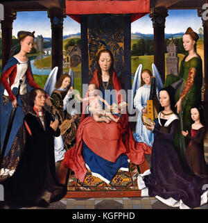 Die Donne Triptychon 1478 Hans Memling (memlinc) 1430 - 1494 Deutscher Deutschland (dem zentralen Bedienfeld zeigt Sir John Donne, begleitet von der hl. Katharina, in Anbetung knien auf die Jungfrau und das Kind, während die Heilige Barbara begleitet Dame Donne und ihre Tochter. ) Stockfoto