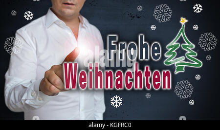 Frohe Weihnachten (Frohe Weihnachten) Konzept Touchscreen wird von Menschen betrieben. Stockfoto