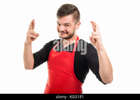 Happy Supermarkt Arbeitgeber Holding double Finger gekreuzt auf weißem Hintergrund isoliert Stockfoto