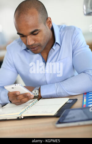 Junge Unternehmer Aufnahme Termin in der Agenda Stockfoto