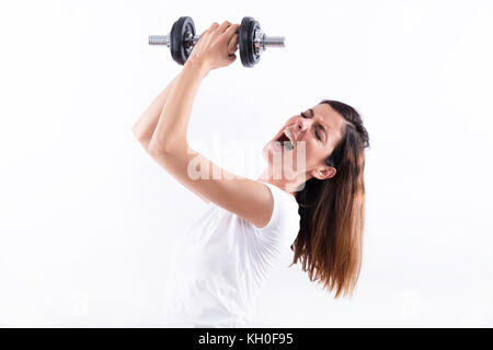 Eine schöne junge Frau heben Gewicht und Schreien Stockfoto