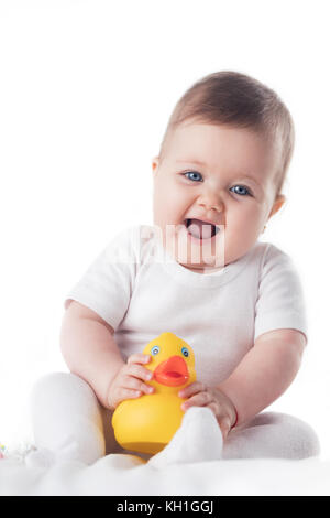 Porträt einer Smilling Baby Mädchen auf weißem Hintergrund Stockfoto