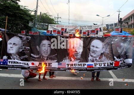 Manila, Philippinen. 13 Nov, 2017. militante Gruppe, Bajan metro manila verbrannten Porträts der Schleifring 5, Leiter der USA, China, Russland, Japan und Australien, die Duldung dieser Länder um die Armut, Hunger und Obdachlosigkeit im Land durch ihre wirtschaftliche Umbrüche des Neoliberalismus und Globalisierung zu Knall während der Protestaktion in Manila City auf sep. 13, 2017 gegen uns Pres. Sie auch gegen gegen uns Pres.Trump besuchen und Aufruf an die US-Intervention Credit: Gregorio b. Dantes jr./Pacific Press/alamy Leben Nachrichten Ende Stockfoto