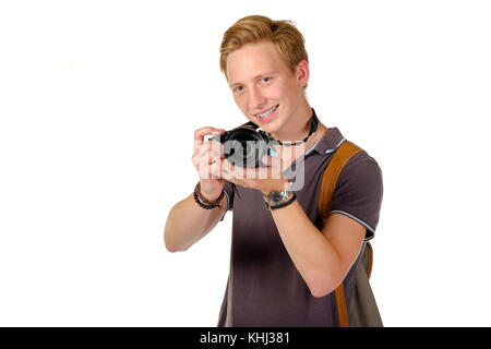 Junger Mann reisender Fotos von DSLR-Kamera isoliert Stockfoto