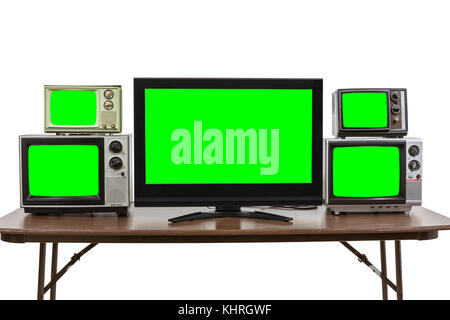 Moderne und klassische Fernseher auf dem Tisch auf Weiß mit Chroma Green Screen fügt isoliert. Stockfoto