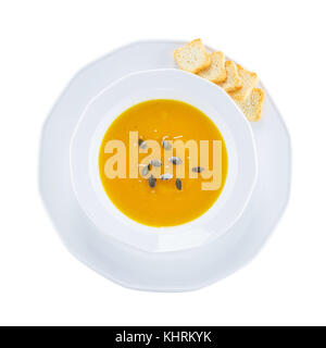Kürbis Cremesuppe mit Samen, Ansicht von oben. mit Freistellungspfaden. Stockfoto