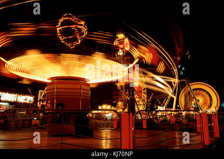 Fairground Rides Spinning in Motion at Night, Washington DC, USA Stockfoto