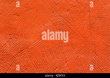 Hintergrund, Textur: orange grob verputzte Wand Stockfoto