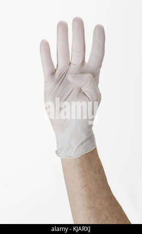 Handschuhen Glove Hand zeigt die Nummer Vier Stockfoto