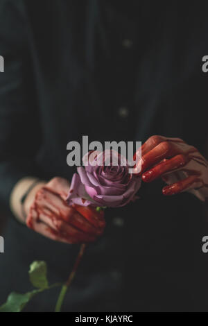 Blutige rosa Rose Stockfoto