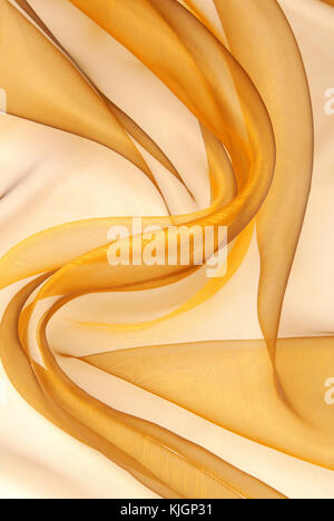 Golden organza Stoff wellige Textur Stockfoto