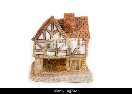 Miniatur Haus isoliert auf weiss Stockfoto