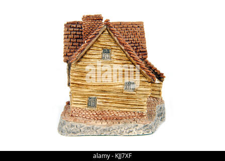 Miniatur Haus isoliert auf weiss Stockfoto