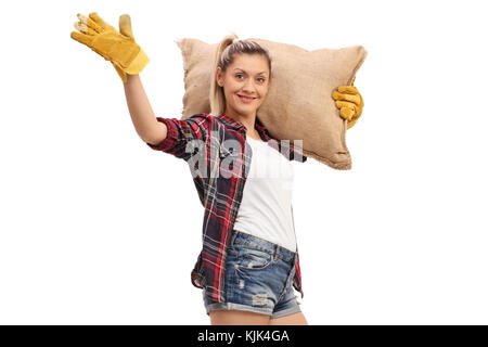 Frau Bauer Holding eine sackleinen Sack und winken in die Kamera auf weißem Hintergrund Stockfoto