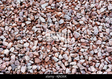 Voller Rahmen von kleinen Steinen Hintergrund. Stockfoto