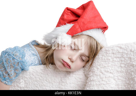 7-Jähriges Mädchen schlafen in Sleeping Beauty Dress und Santa hat. Stockfoto