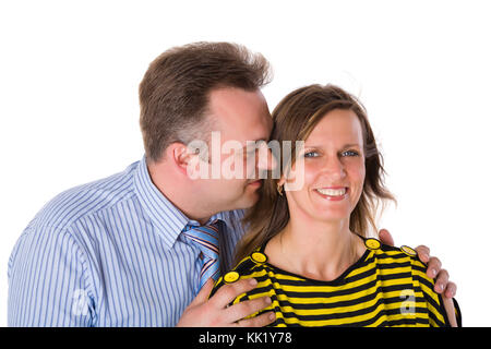Fröhliche applying paar Lachen isoliert auf weiss Stockfoto