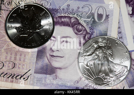 1 Unze Silber Anlagemünzen und Britisches Pfund Stockfoto