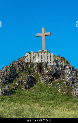 St Dwynwens Kreuz auf Ynys Llanddwyn auf Anglesey, Wales, Großbritannien Stockfoto
