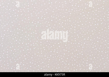 Grau Papier Hintergrund mit einem Muster von Schnee. Stockfoto