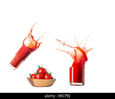 Tomatensaft splash um großartige Wellen und Tropfen mit Tomaten. Stockfoto