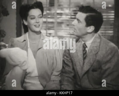 Rosalind Russell und Walter Pidgeon spielen die Hauptrollen des Films *Design for Scandal* aus den 1930er Jahren, wie sie in diesem Werbetrailer zu sehen sind. Der Film zeigt klassische Hollywood-Auftritte im Comedy-Drama-Genre. Stockfoto