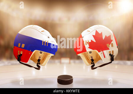 Low Angle View hockey Helme mit Kanada und Russland Fahnen bemalt und Hockey Puck auf dem Eis in hell erleuchteten Stadion Hintergrund. Konzept der intensiven Ri Stockfoto