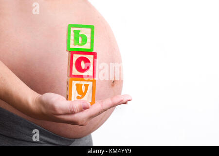Schwangere Frau mit jungen Wort Stockfoto