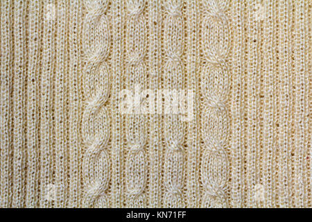Hintergrund Textur von beige Muster Gestrick aus Baumwolle oder Wolle closeup Stockfoto