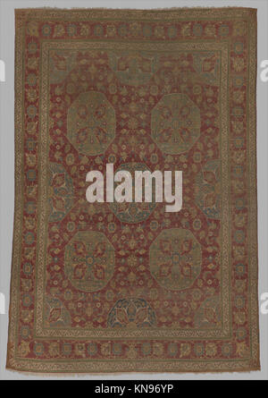 Dieser Teppich veranschaulicht traditionelles Textildesign, handwerkliches Können und Muster und spiegelt historische und kulturelle Praktiken wider, die in der MET-Kollektion katalogisiert sind. Stockfoto