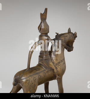 Ein mittelalterliches Aquamanil in Form eines Ritters zu Pferd, das als Waschschiff verwendet wurde und in der Met erhalten wurde, um Handwerkskunst und Design zu veranschaulichen. Stockfoto